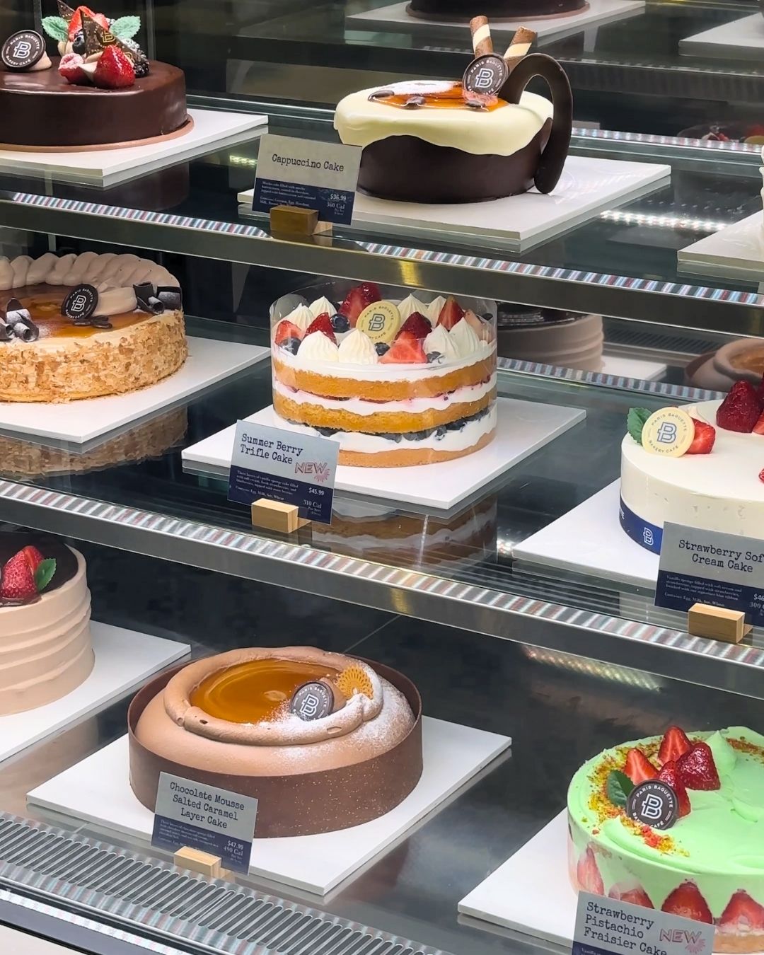 Display filled with beautifully decorated layered cakes