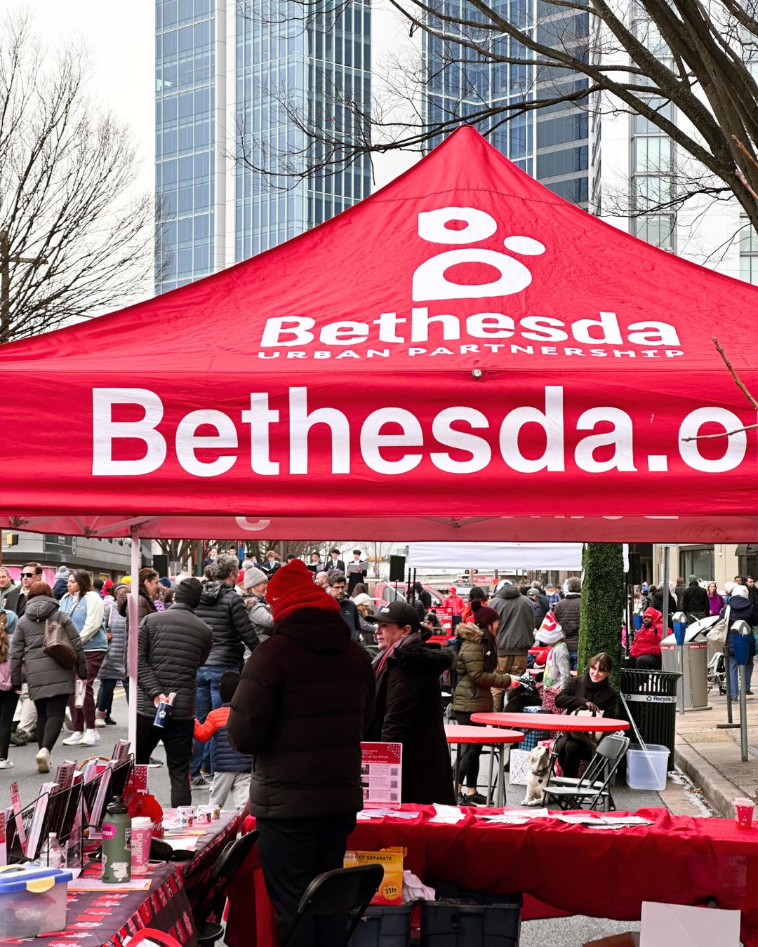 Red Bethesda Urban Partnership tent near the Winter Wonderland stage.