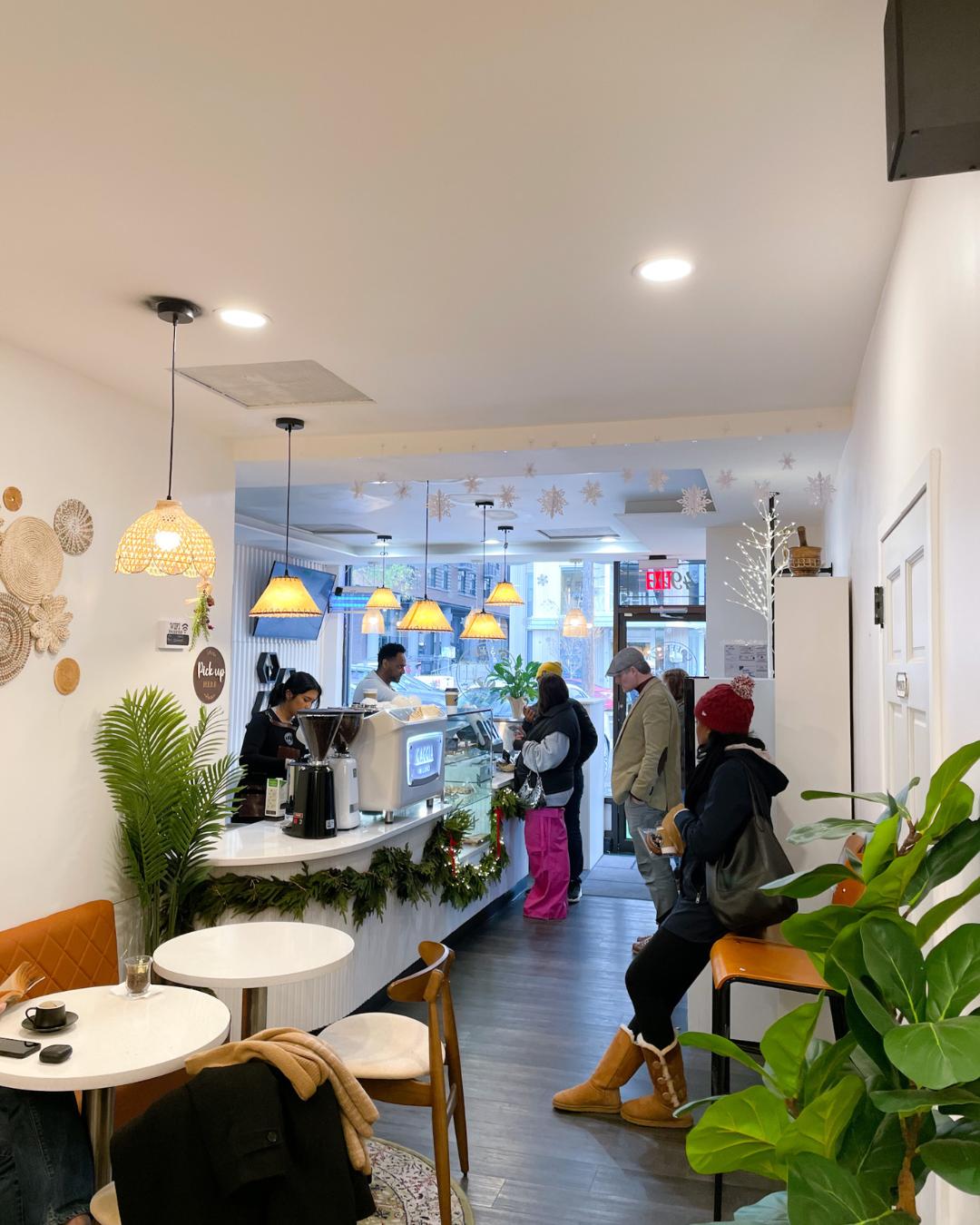 Bright interior of Coffeefi Roastery in Bethesda with customers ordering at the counter