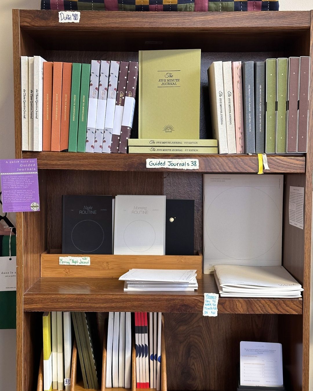 Shelves displaying guided journals, and morning and night routine notebooks at Bethesda gift shop