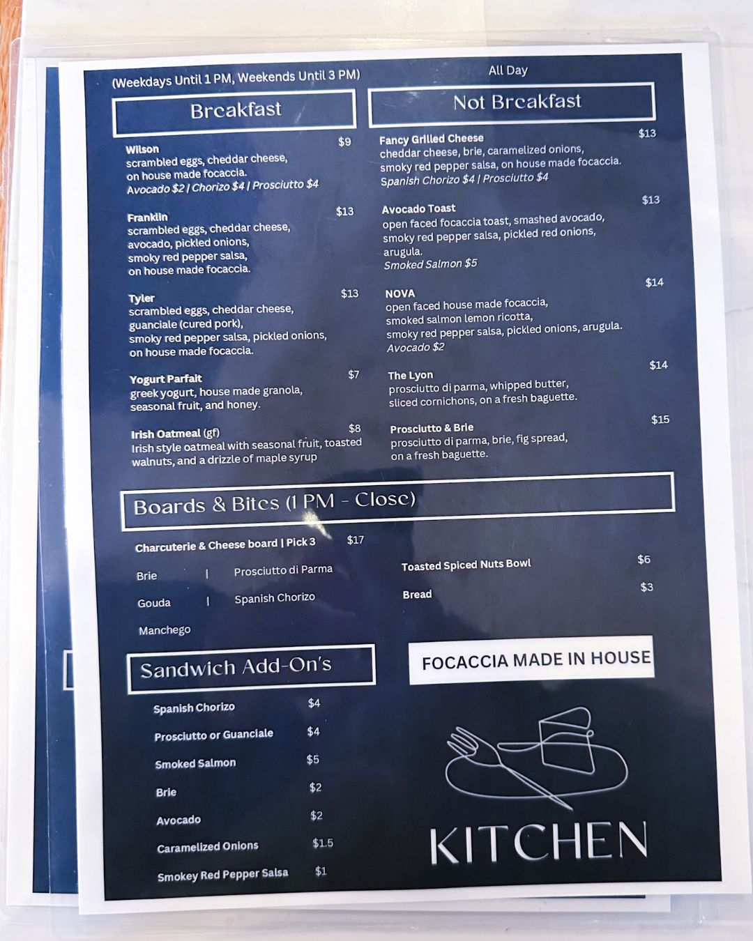 Full menu at Downtown Bethesda Simona Cafe showing breakfast and all day menu items, “Boards & Bites” after 1pm, and sandwich add-ons.