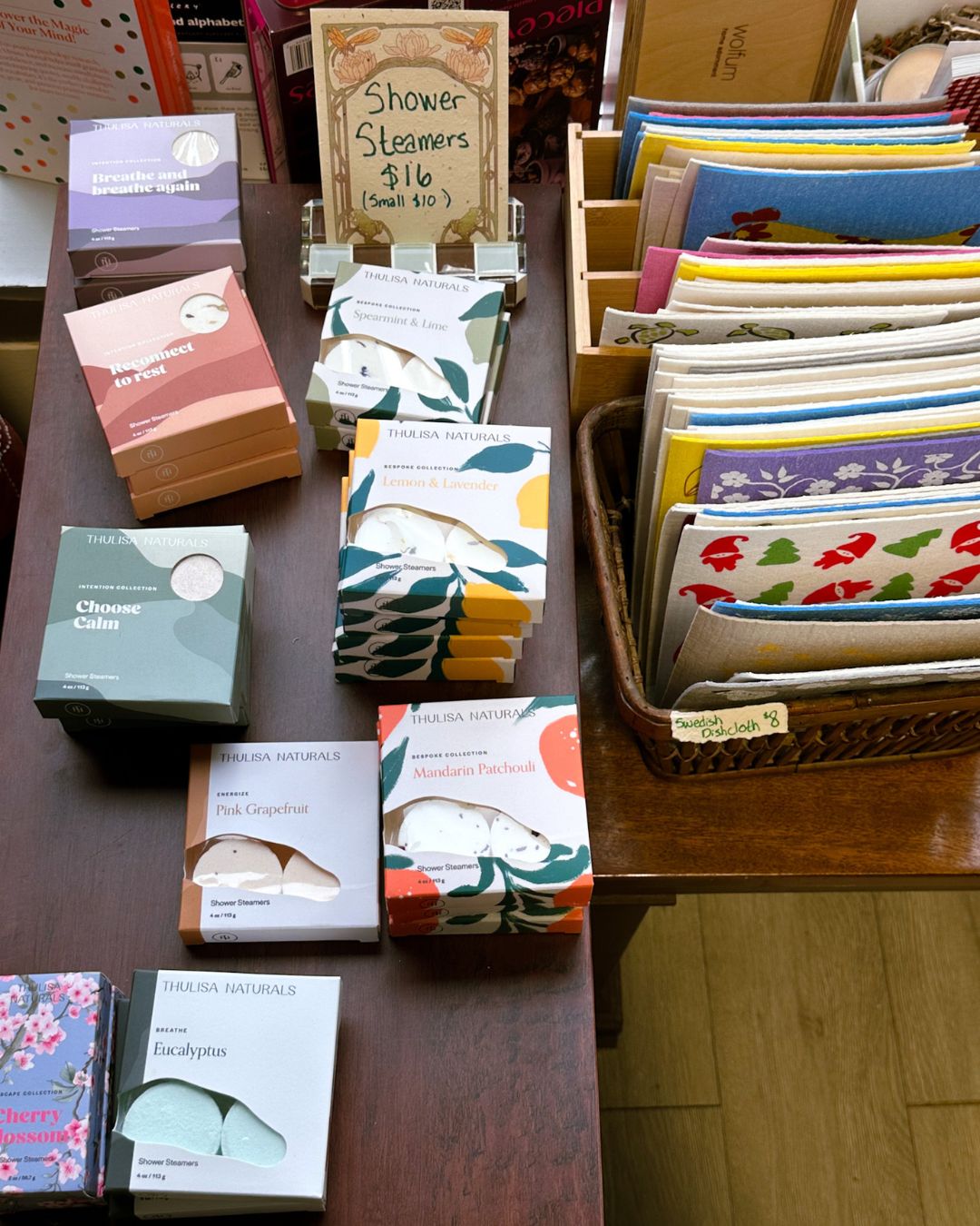 Display of shower steamers and Swedish dishcloths in a woven basket
